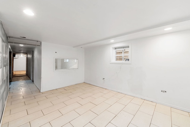 unfurnished room featuring light tile patterned floors