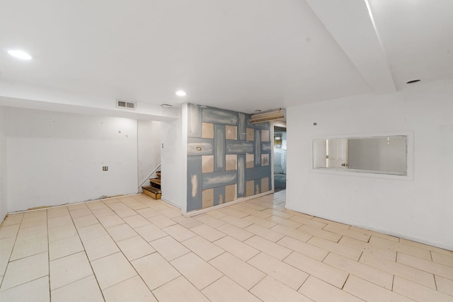 spare room featuring light tile patterned floors