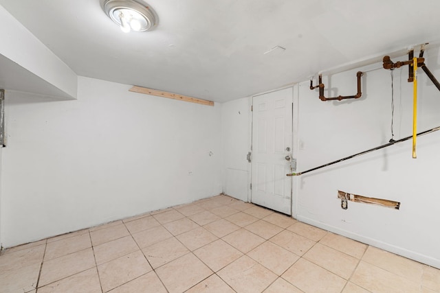 basement featuring light tile patterned floors