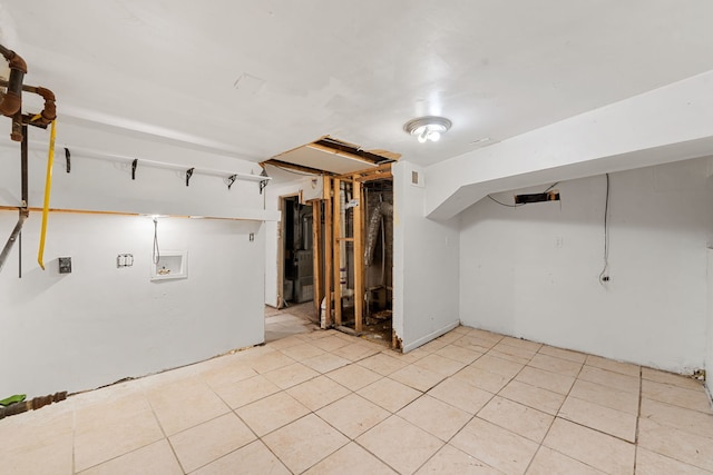 basement featuring light tile patterned flooring