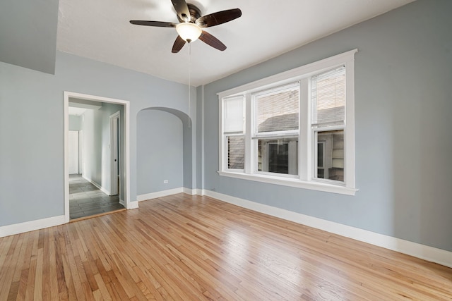 spare room featuring ceiling fan and light hardwood / wood-style floors