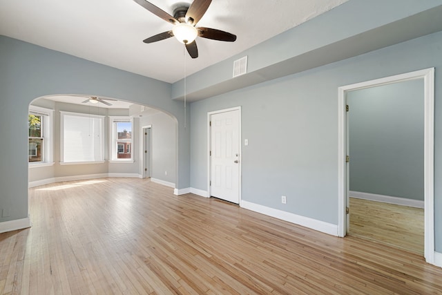 unfurnished room featuring ceiling fan and light hardwood / wood-style floors