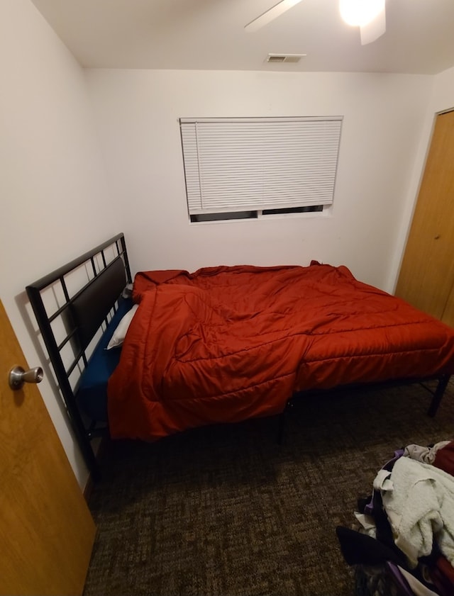 carpeted bedroom featuring ceiling fan