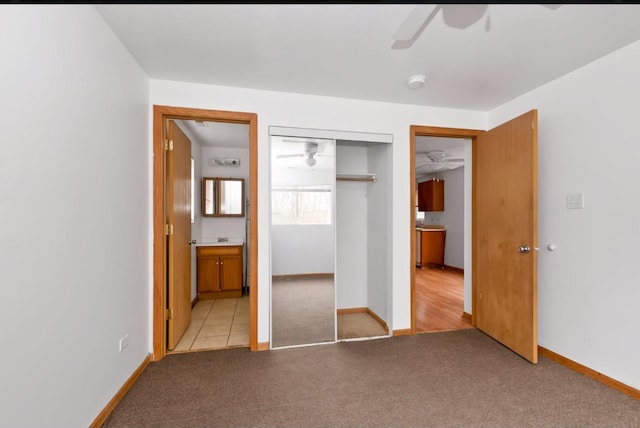 800 Sangamon St, Chicago Heights, IL 60411 - unfurnished bedroom with light colored carpet, a closet, baseboards, a ceiling fan, and connected bathroom