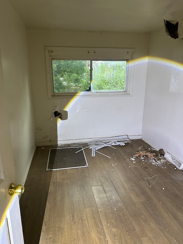 unfurnished room featuring hardwood / wood-style floors