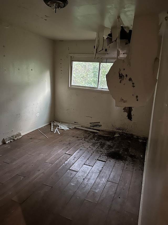 empty room with wood-type flooring