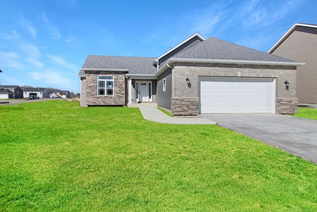 view of front facade with a garage and a front lawn