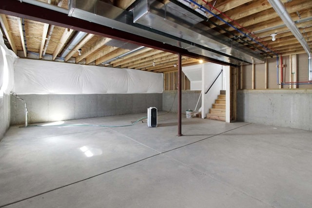 unfinished basement with stairs