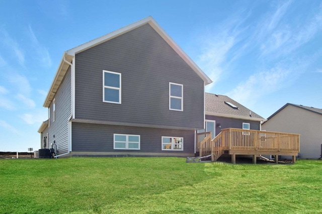 back of property featuring a lawn, a wooden deck, and central air condition unit