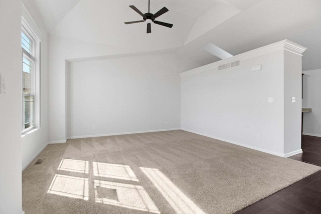 interior space with lofted ceiling, visible vents, ceiling fan, and baseboards