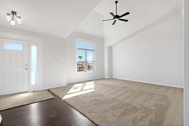 entrance foyer featuring high vaulted ceiling, ceiling fan, baseboards, and wood finished floors