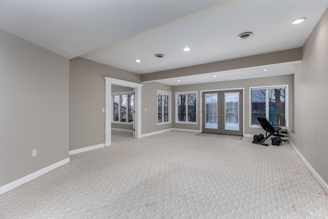 unfurnished room featuring french doors, recessed lighting, visible vents, and baseboards