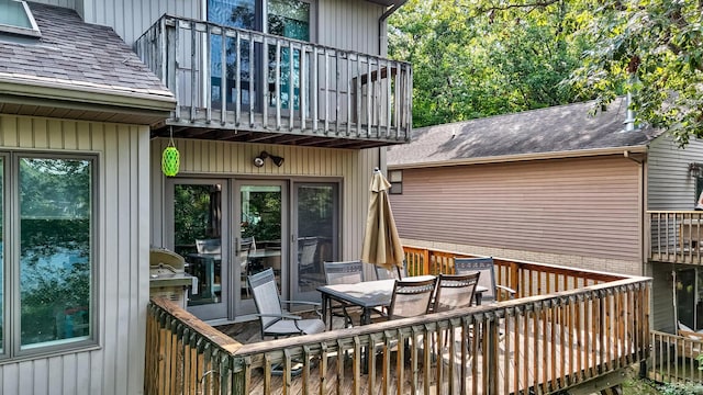 wooden terrace featuring outdoor dining space