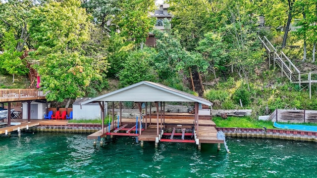 dock area with a water view and boat lift