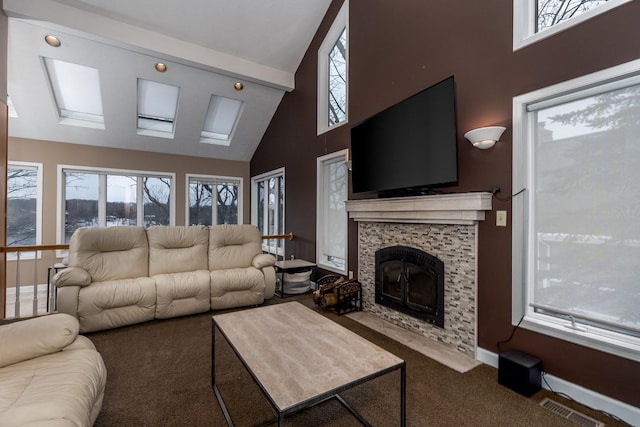 carpeted living room featuring high vaulted ceiling, baseboards, visible vents, and a tiled fireplace