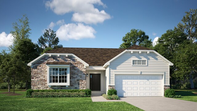 view of front of house featuring a garage and a front lawn