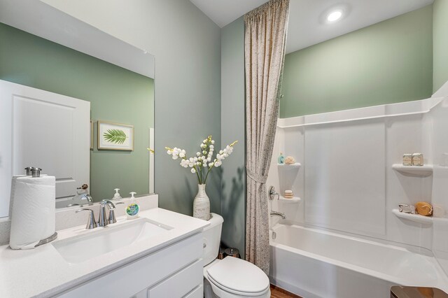 full bathroom featuring vanity, toilet, and shower / bath combo with shower curtain