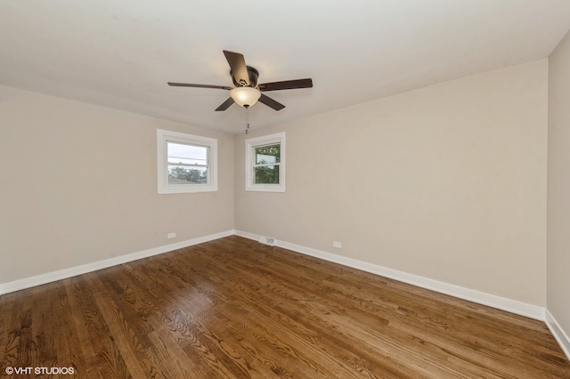 spare room with hardwood / wood-style floors and ceiling fan