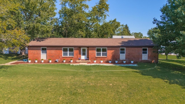 single story home featuring a front yard