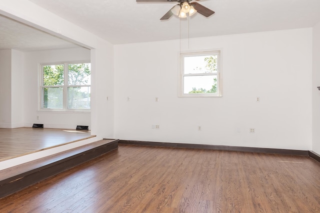 spare room featuring hardwood / wood-style flooring and ceiling fan