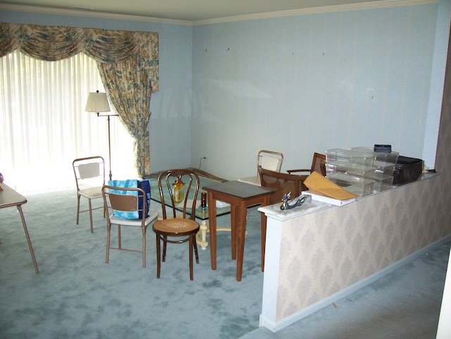 carpeted dining area with crown molding