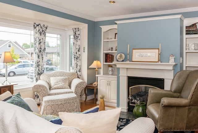 living room featuring crown molding, built in features, and hardwood / wood-style floors