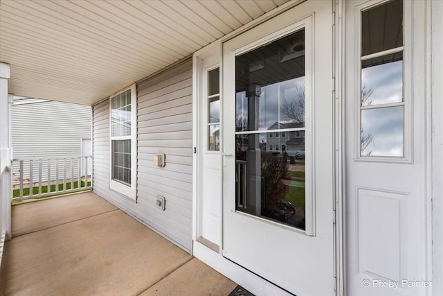 view of exterior entry featuring a porch