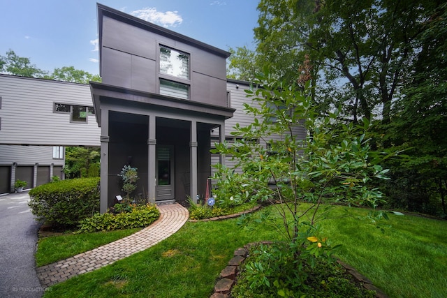 exterior space featuring a yard and a garage