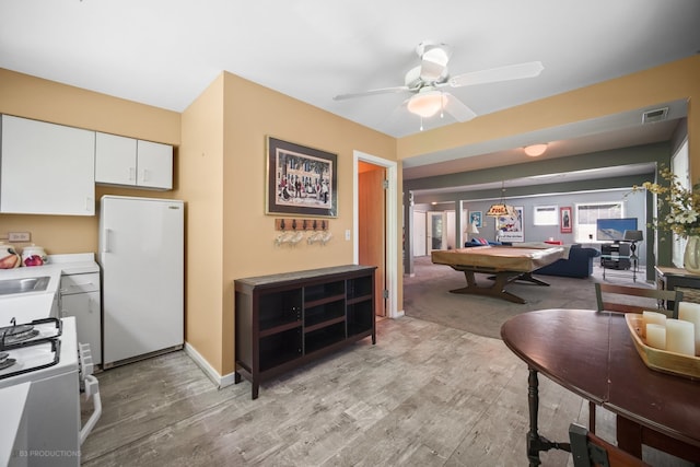 dining room featuring hardwood / wood-style floors, billiards, sink, and ceiling fan