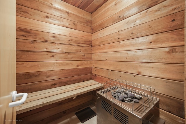 view of sauna featuring wood walls