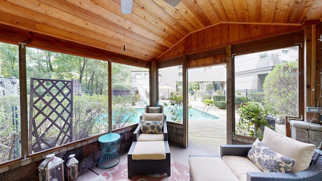 sunroom / solarium with wood ceiling, a healthy amount of sunlight, and vaulted ceiling