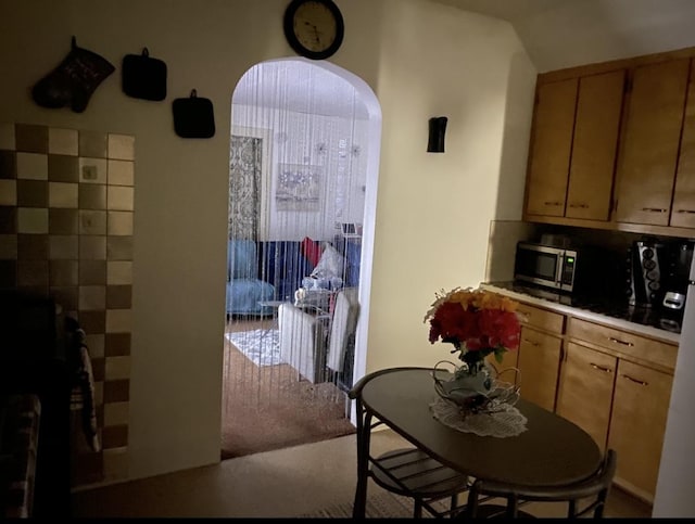 dining area with arched walkways