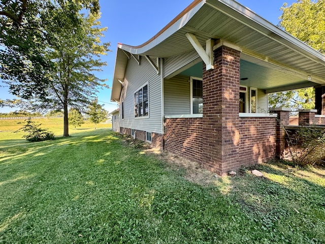 view of home's exterior featuring a yard