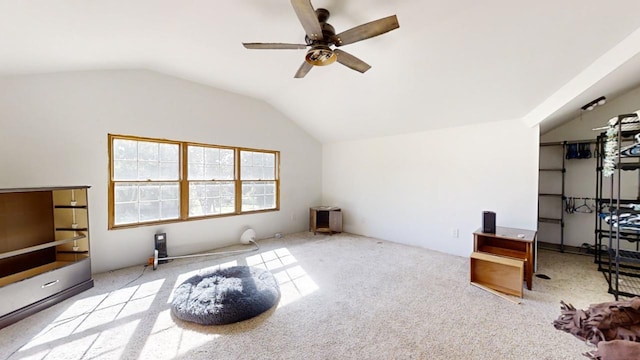 workout area featuring light colored carpet, ceiling fan, and lofted ceiling