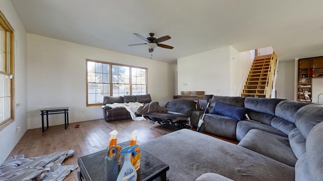 living room with hardwood / wood-style floors and ceiling fan