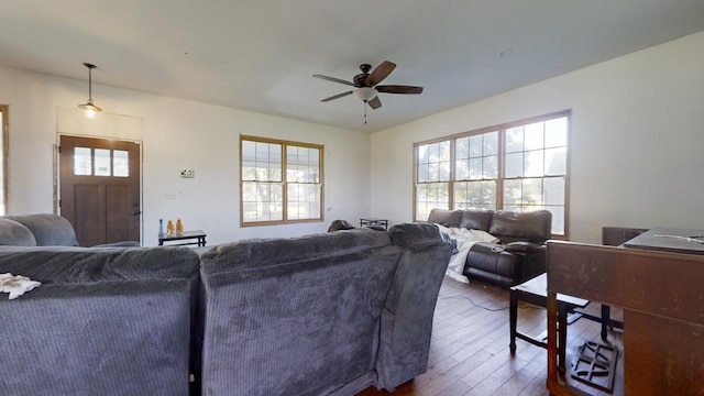 living room with ceiling fan, dark hardwood / wood-style flooring, and a healthy amount of sunlight