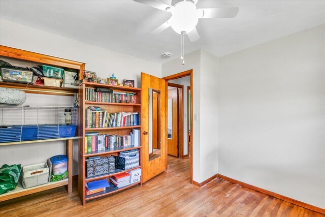 interior space with ceiling fan and light wood-type flooring