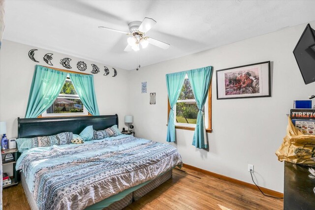 bedroom featuring hardwood / wood-style floors and ceiling fan