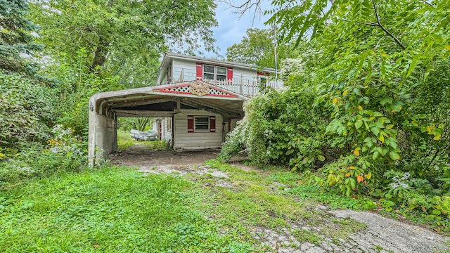 view of outbuilding featuring a carport