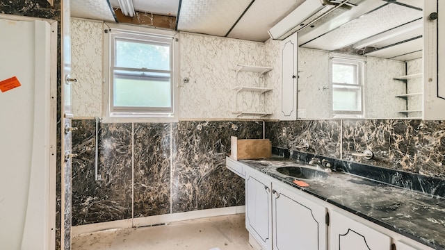 bathroom featuring vanity and a wealth of natural light