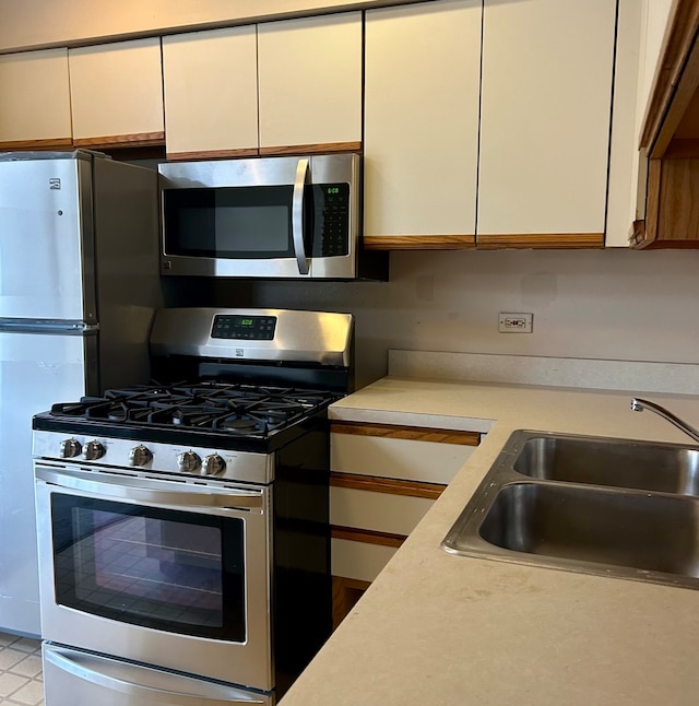 kitchen featuring stainless steel appliances and sink