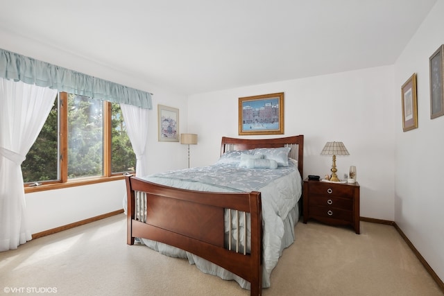 bedroom with light colored carpet