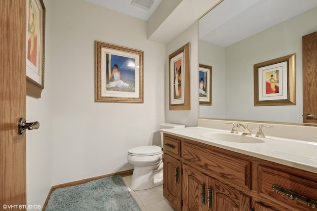 bathroom featuring vanity, toilet, and tile patterned flooring