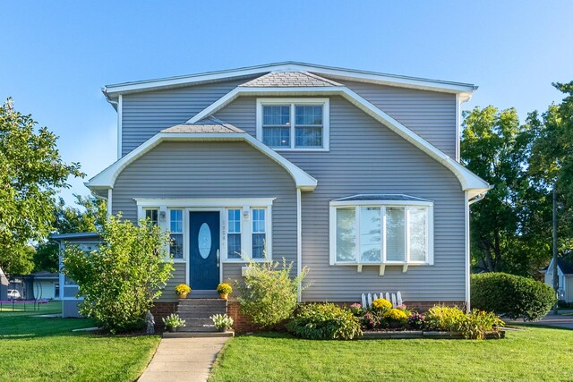 view of front of home with a front yard