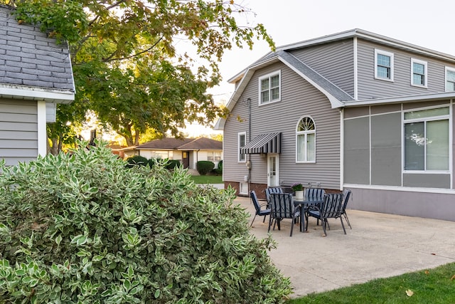 back of property featuring a patio area