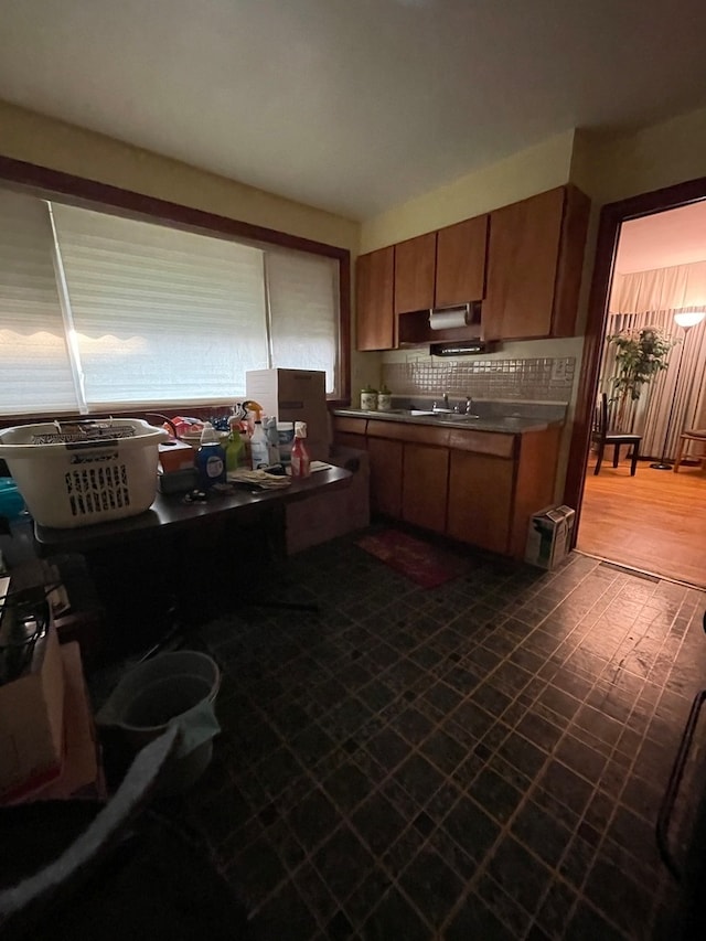 kitchen featuring sink and decorative backsplash