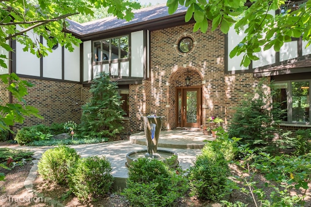 back of property with french doors and a patio area