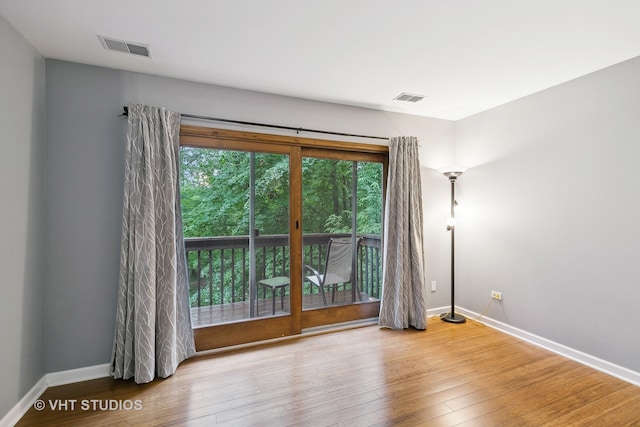 unfurnished room with light hardwood / wood-style floors