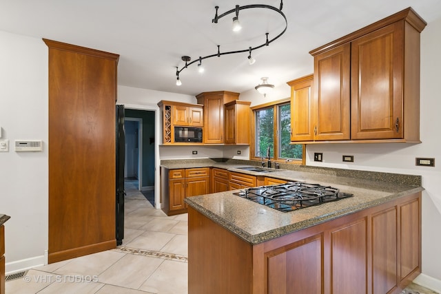 kitchen with black appliances, kitchen peninsula, sink, and light tile patterned floors