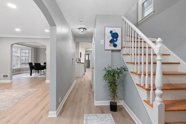 staircase with hardwood / wood-style flooring